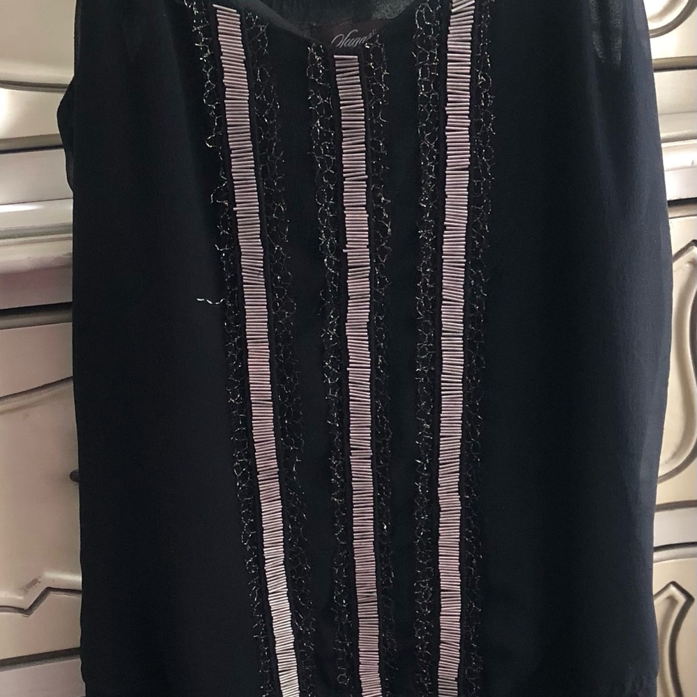 Black silk short dress, with silver beading in front, dress is loose fitting.